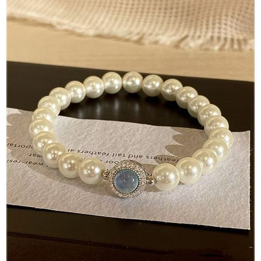 PEARL GLOW- SIMULATED PEARL BRACELET WITH BLUE CAT`S STONE