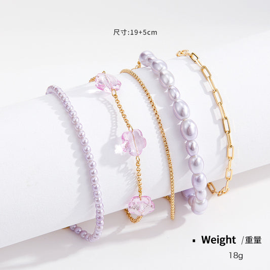 PURPLE LAYERED SET-5 BRACELET WITH MIXED CHAIN,SIMULATED PEALS & RESIN FLOWER