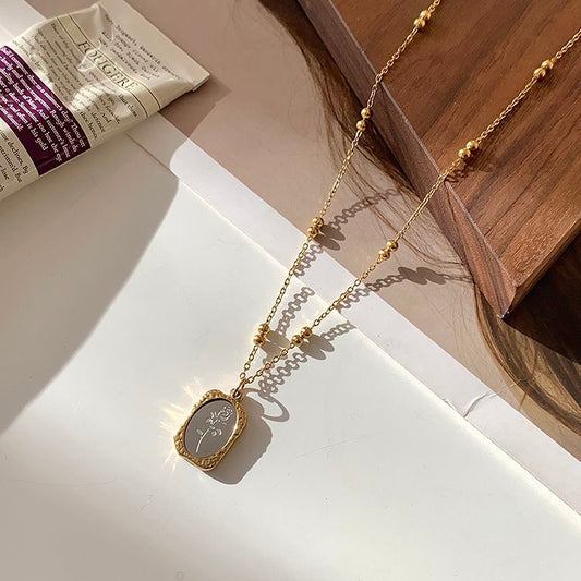 fine steel beaded titanium chain necklace with metal square floral pendant