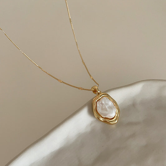 Mother-of-Pearl Pendant
18K gold plated with irregular mother if pearl pendant on fine chain necklace 