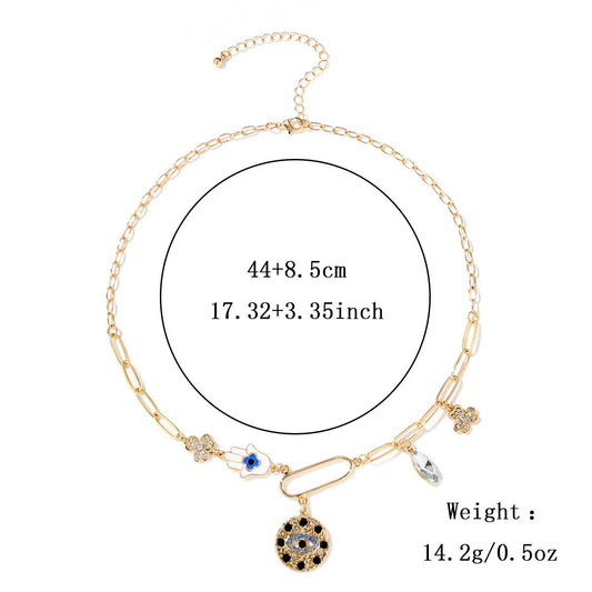 18Kgold plated geometric chain necklace with simulated diamonds and evil eye pendant